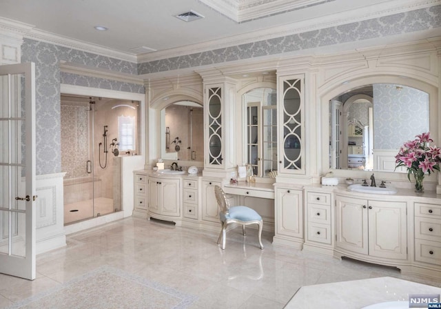 bathroom featuring vanity, crown molding, and walk in shower