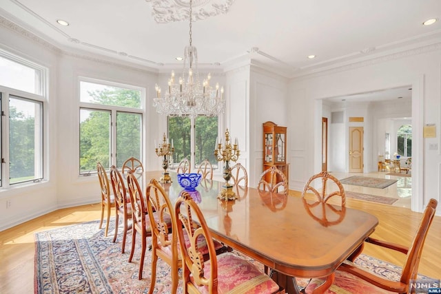 dining area featuring a notable chandelier and ornamental molding