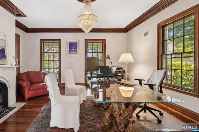 office area with ornamental molding, dark hardwood / wood-style flooring, a healthy amount of sunlight, and a notable chandelier