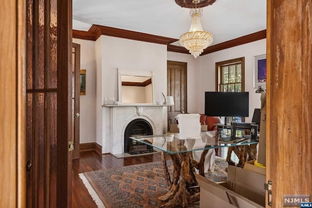 home office featuring ornamental molding, dark wood-type flooring, and a chandelier