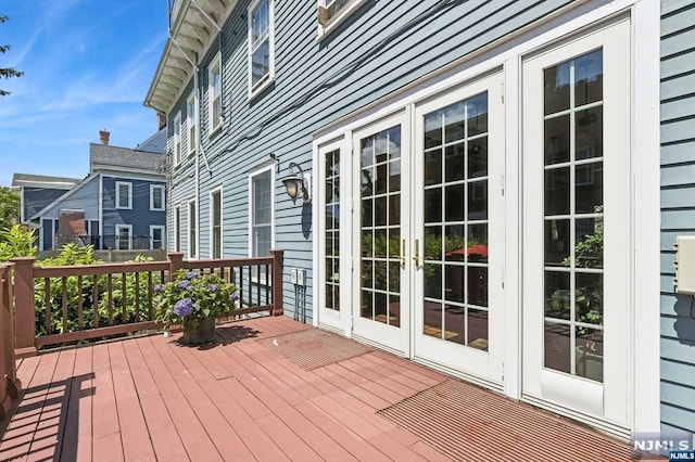 wooden deck featuring french doors