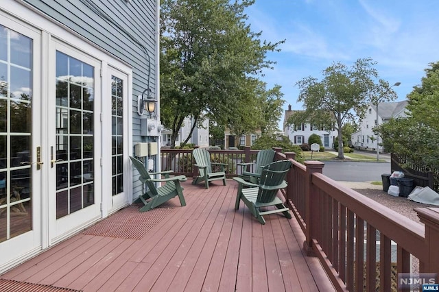 wooden deck featuring french doors