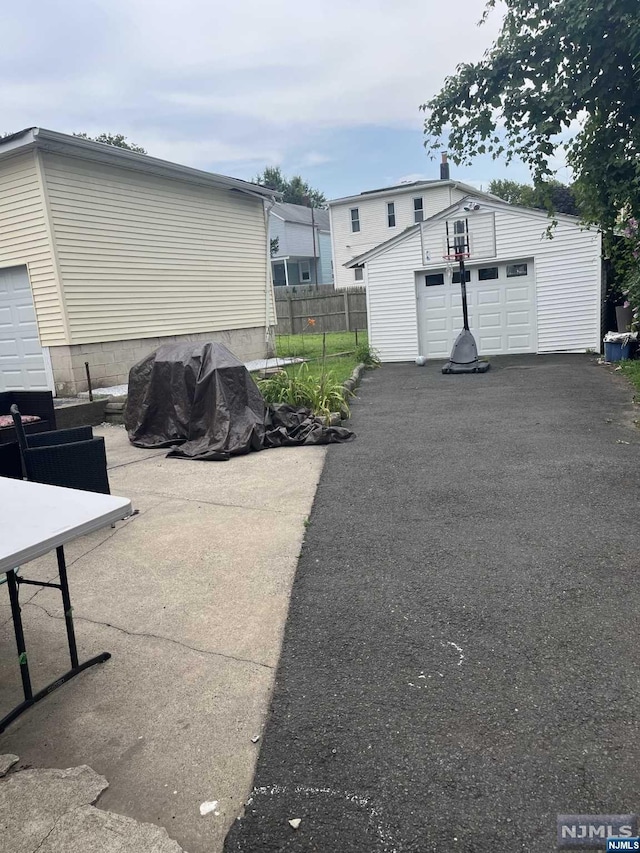 exterior space featuring an outdoor structure and a garage