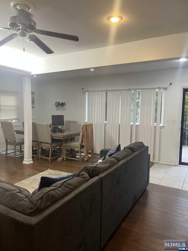 living room with ceiling fan and hardwood / wood-style floors