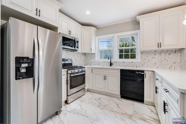 kitchen with white cabinets, crown molding, sink, tasteful backsplash, and stainless steel appliances