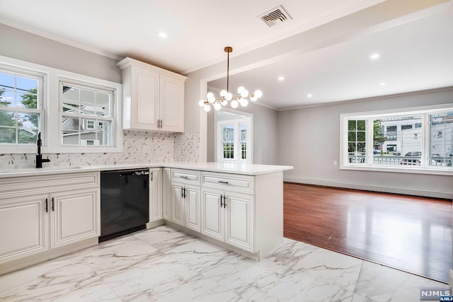 kitchen with plenty of natural light, sink, kitchen peninsula, and black dishwasher