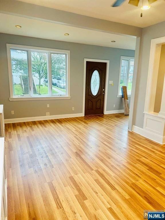 entrance foyer with light hardwood / wood-style flooring