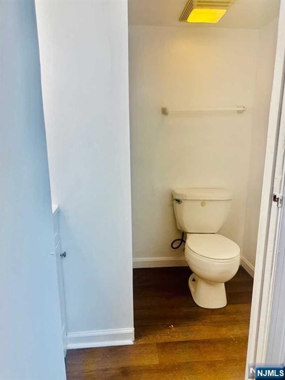 821 Roosevelt Ave, Secaucus, NJ 07094 - bathroom with wood-type flooring and toilet
