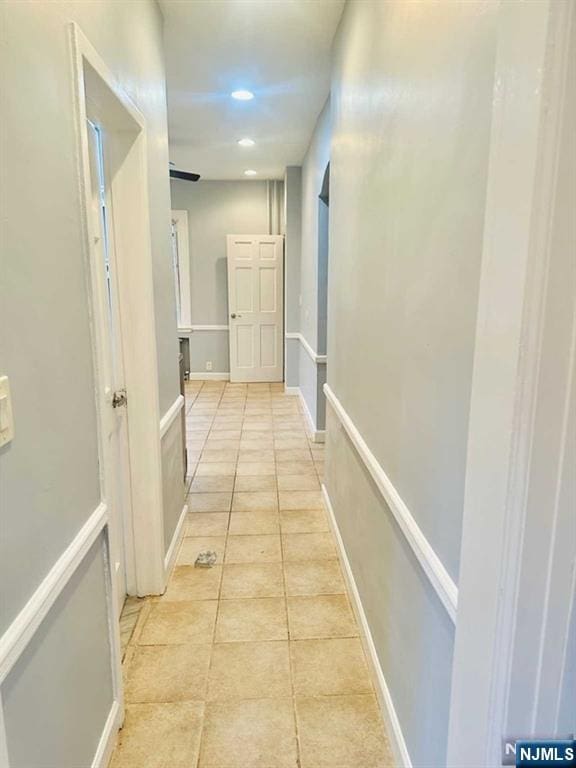 821 Roosevelt Ave, Secaucus, NJ 07094 - hallway featuring light tile patterned floors