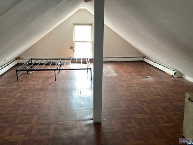 bonus room with baseboard heating, dark parquet flooring, and vaulted ceiling