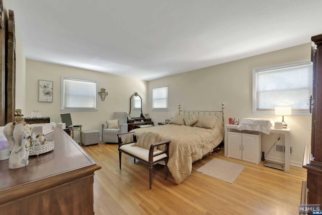 bedroom with light hardwood / wood-style floors