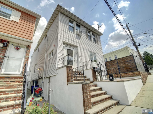 view of front facade with cooling unit