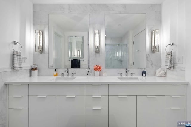 bathroom with vanity and walk in shower