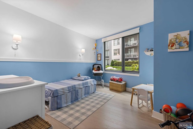 bedroom with light hardwood / wood-style flooring