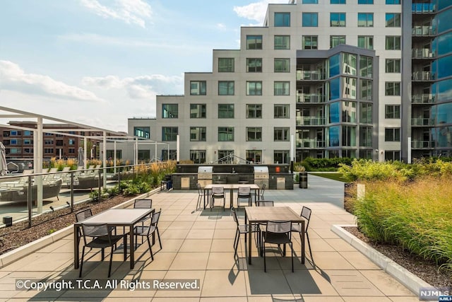 view of patio featuring an outdoor kitchen and area for grilling