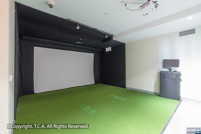 recreation room with light colored carpet and golf simulator