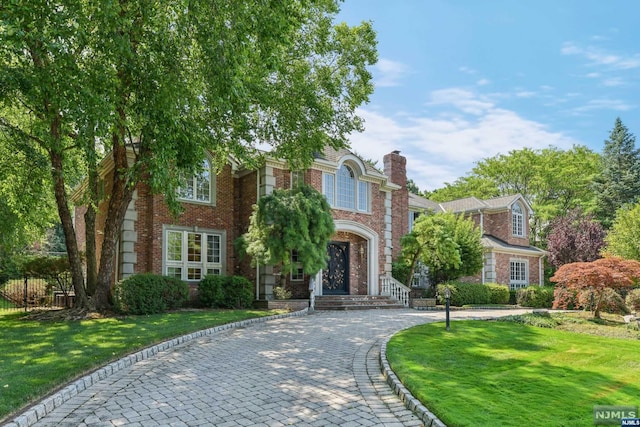 view of front of property with a front lawn