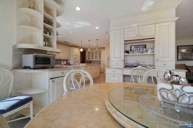 dining area with crown molding