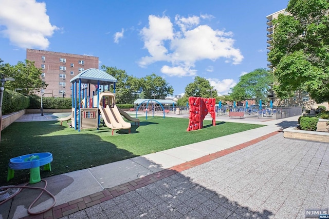 view of jungle gym with a yard