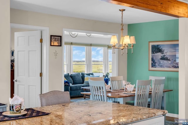 dining room featuring hardwood / wood-style flooring and a notable chandelier