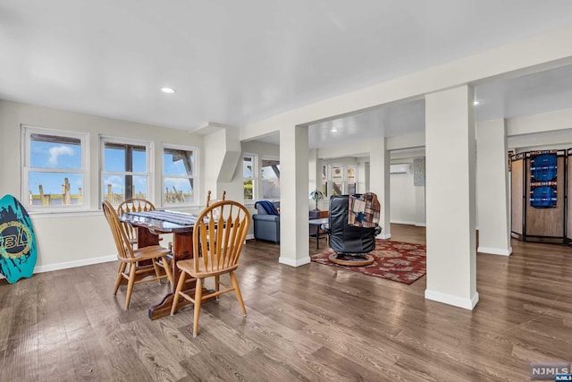 dining space with hardwood / wood-style flooring