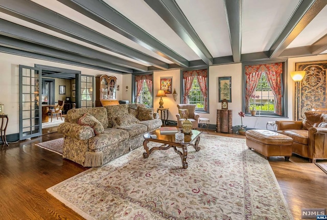 living room featuring beamed ceiling, french doors, and dark hardwood / wood-style floors