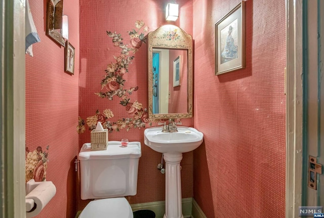 bathroom with toilet and sink