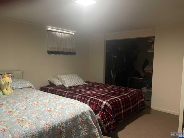 bedroom featuring carpet and a closet