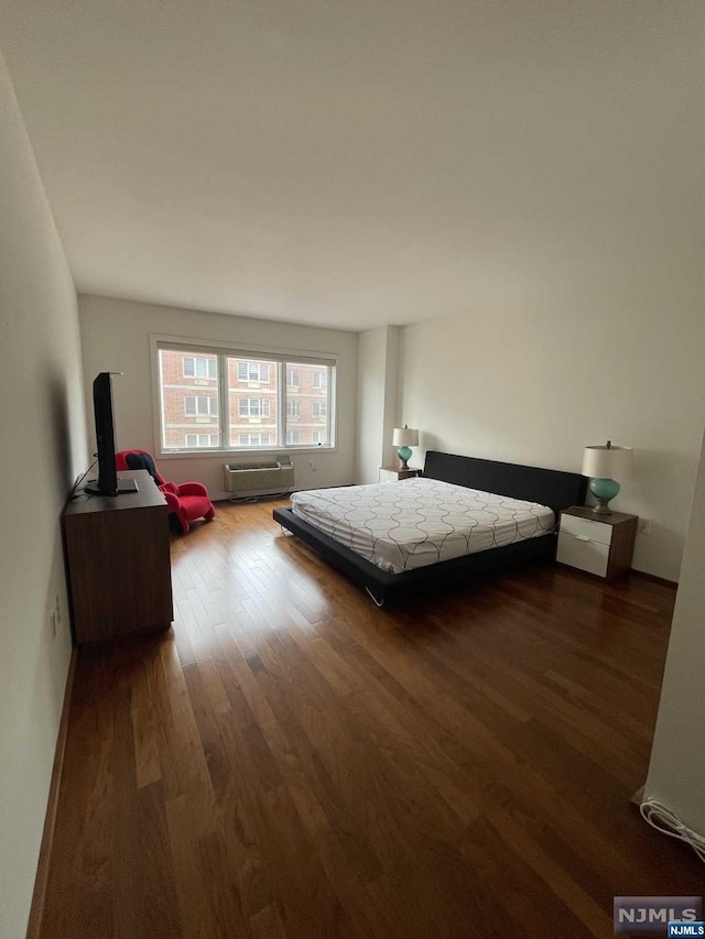 bedroom with wood-type flooring