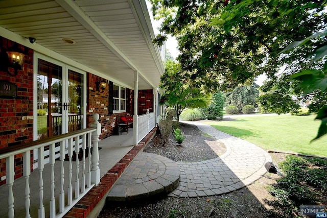 view of patio / terrace with covered porch and french doors