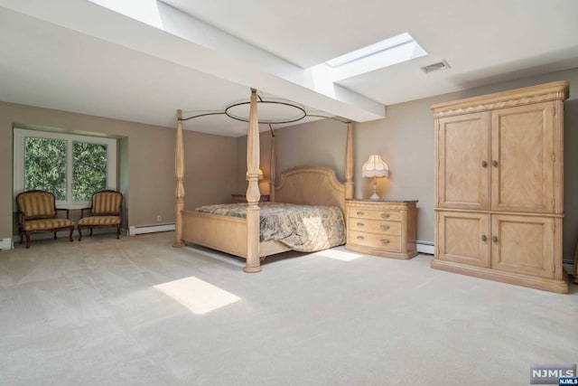 carpeted bedroom featuring a skylight and a baseboard radiator