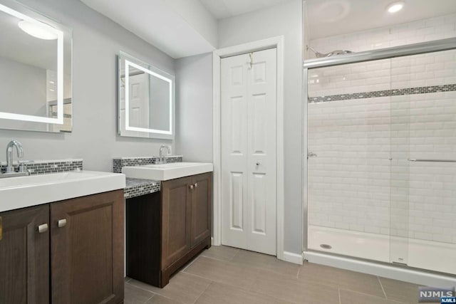 bathroom featuring vanity, tile patterned floors, and an enclosed shower