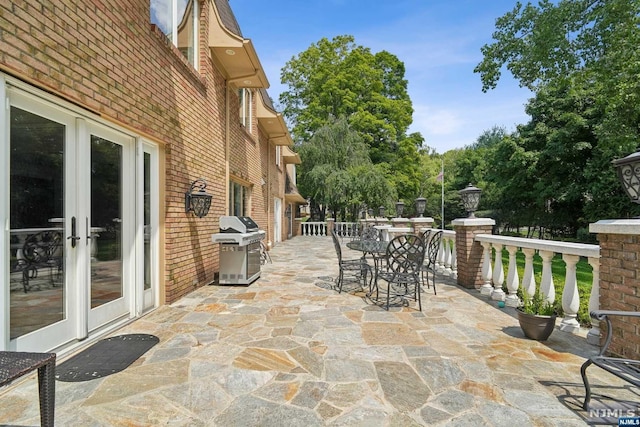 view of patio / terrace with a grill and french doors