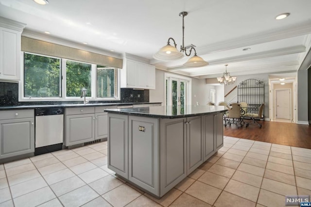 kitchen featuring gray cabinetry, dishwashing machine, light tile patterned floors, a notable chandelier, and white cabinets