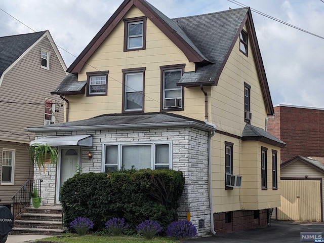 view of front of house featuring cooling unit