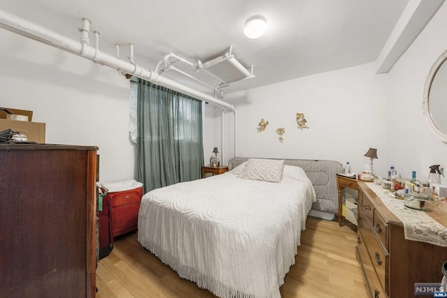 bedroom featuring light hardwood / wood-style floors