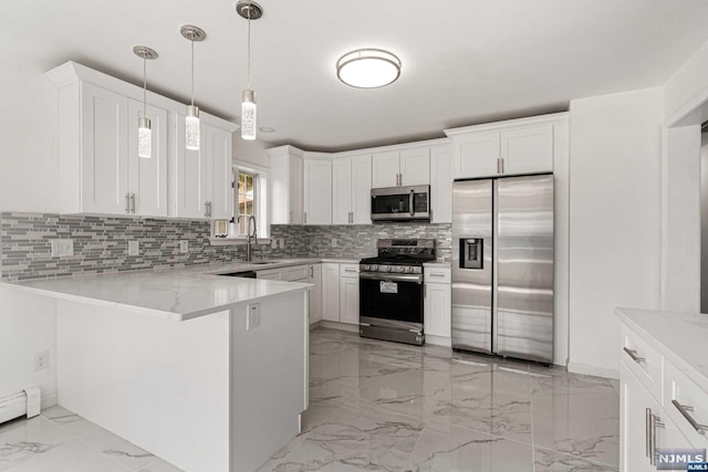 kitchen with kitchen peninsula, white cabinetry, and appliances with stainless steel finishes