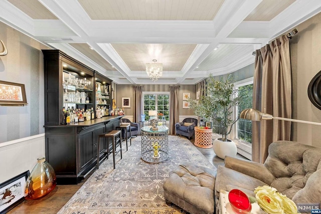 bar with dark hardwood / wood-style floors, beam ceiling, an inviting chandelier, and coffered ceiling