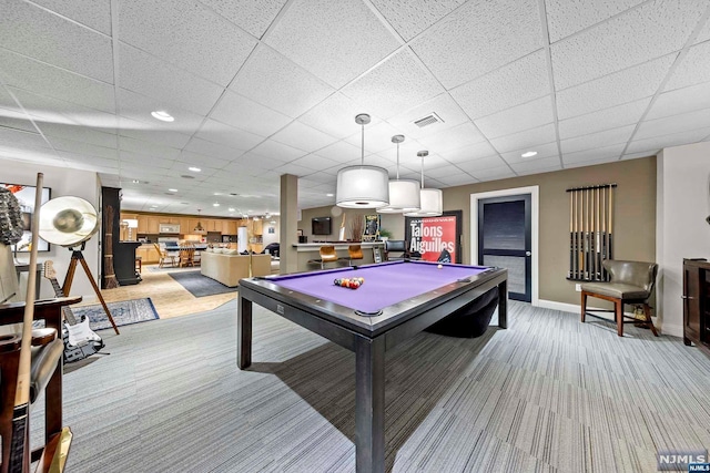 rec room featuring light carpet, a drop ceiling, and pool table