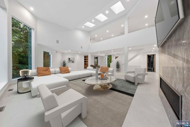 living room with a towering ceiling