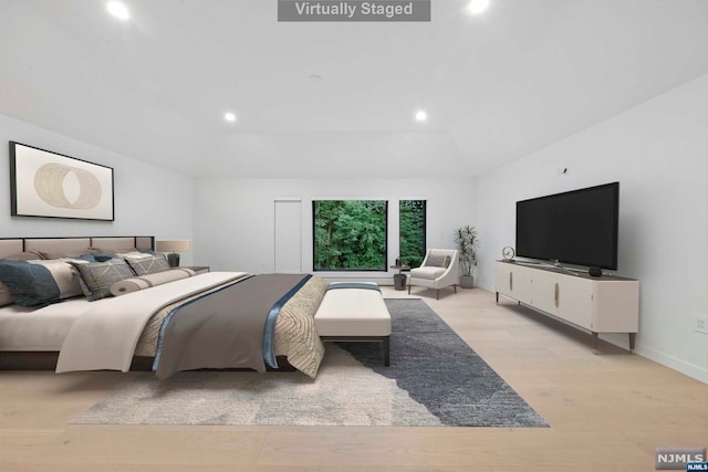 bedroom with light hardwood / wood-style flooring