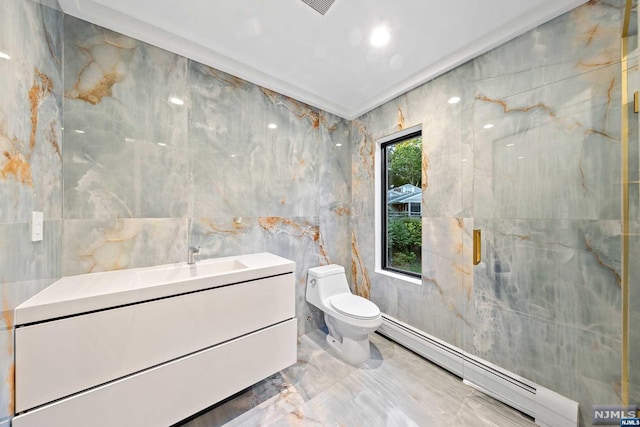 bathroom with vanity, a baseboard radiator, tile walls, and toilet