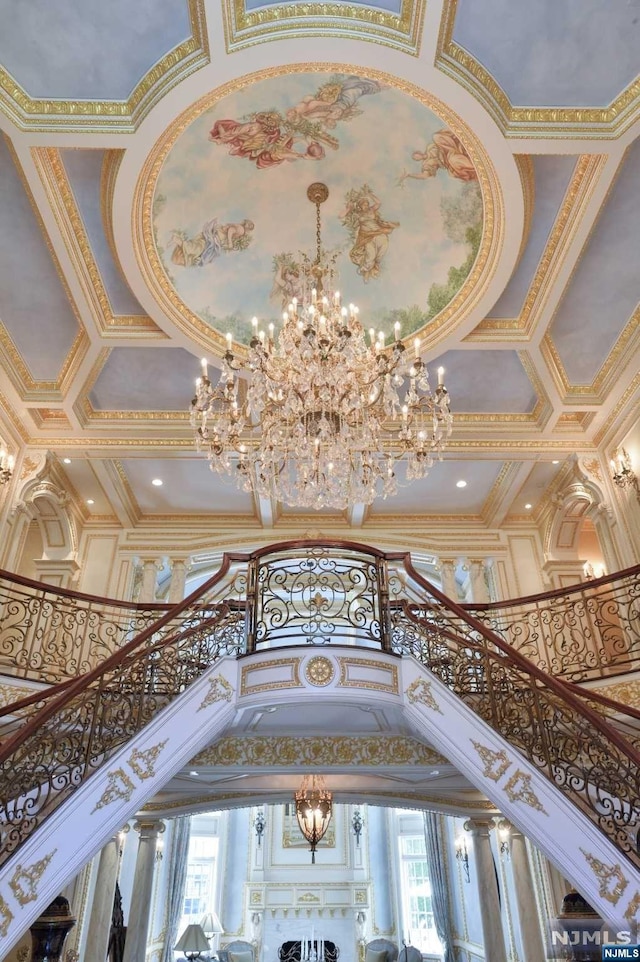 interior details featuring an inviting chandelier and ornamental molding