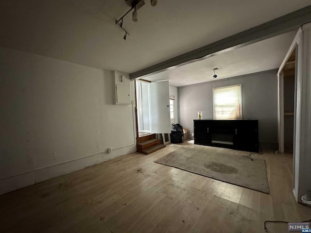 unfurnished room featuring light hardwood / wood-style floors and track lighting