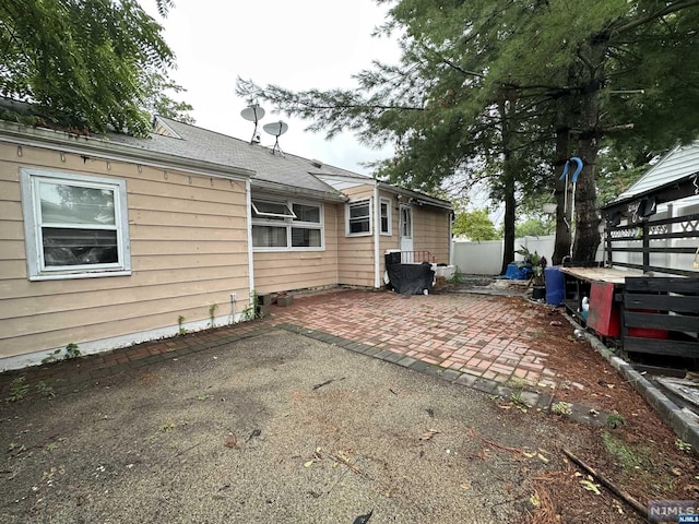 view of side of home featuring a patio