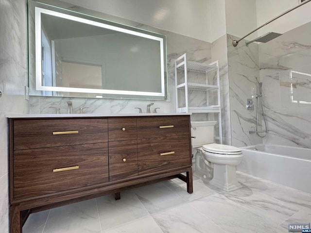 full bathroom featuring tiled shower / bath, vanity, and toilet