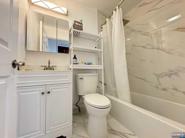 full bathroom with vanity, shower / bath combination with curtain, and toilet