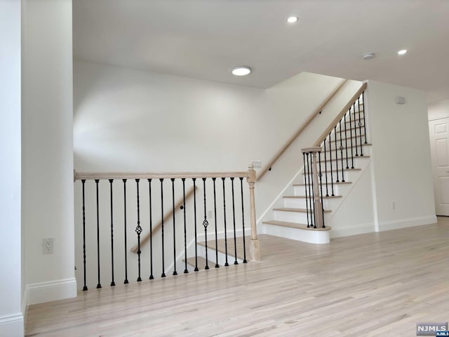 stairs with wood-type flooring