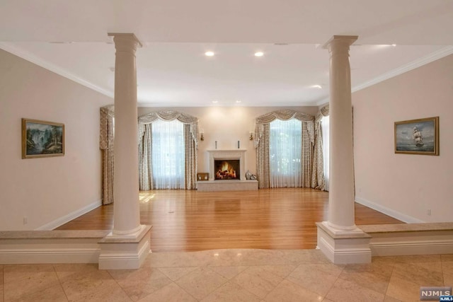 unfurnished living room with light wood-type flooring and crown molding