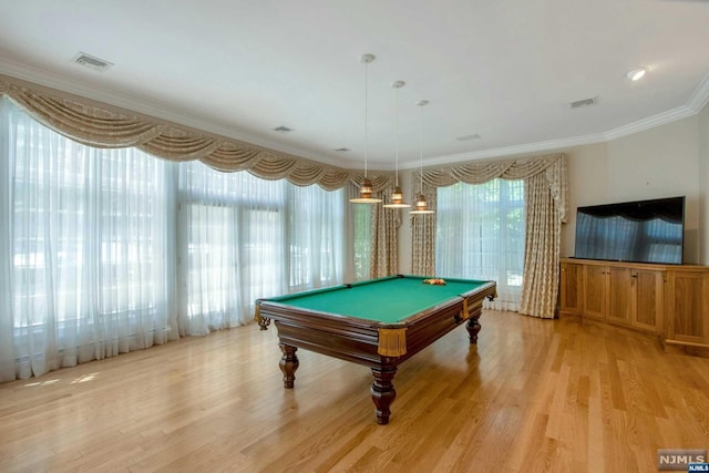 recreation room featuring light hardwood / wood-style floors, ornamental molding, and billiards